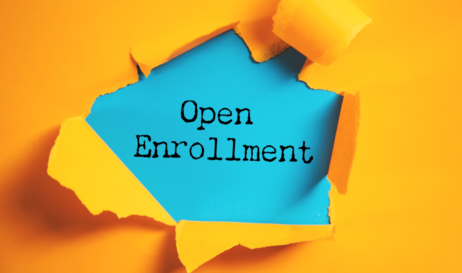 Open Enrollment text revealed through torn orange paper