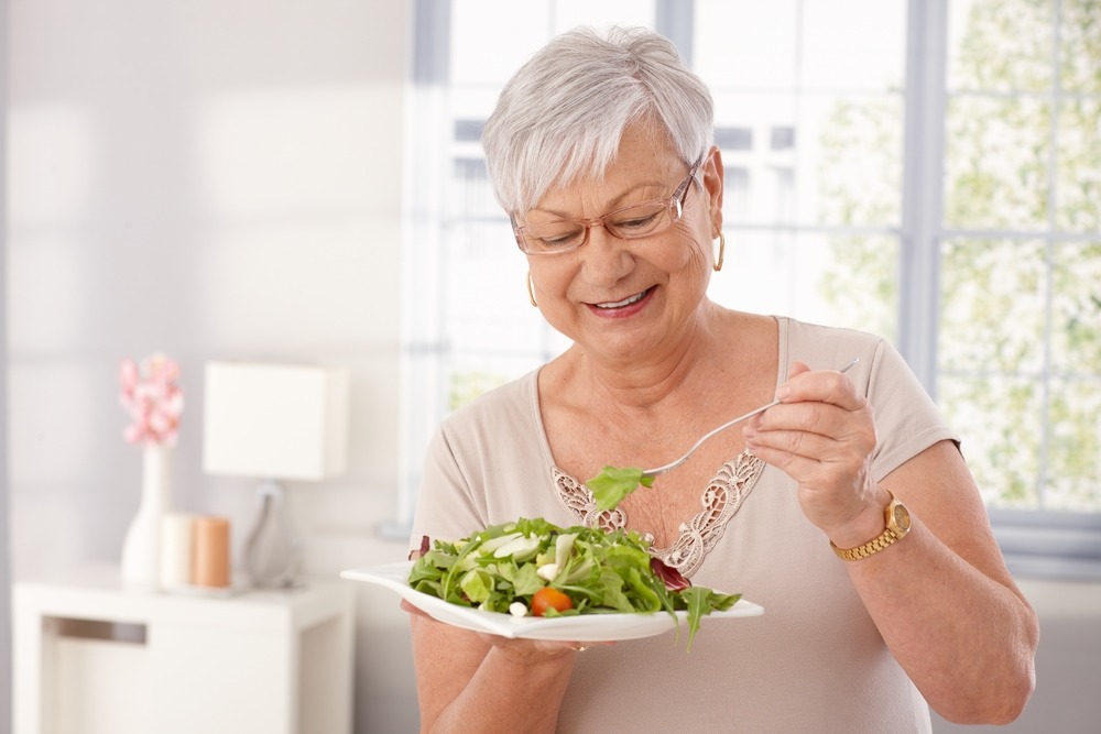 Happy,Old,Lady,Eating,Fresh,Green,Salad,,Smiling.