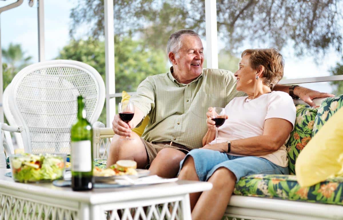 The Abbey | Seniors sitting on a patio